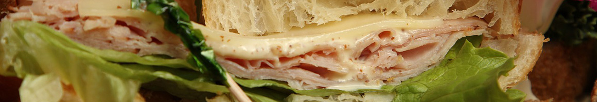 Eating Sandwich at Nalu Health Bar & Cafe restaurant in Kailua, HI.